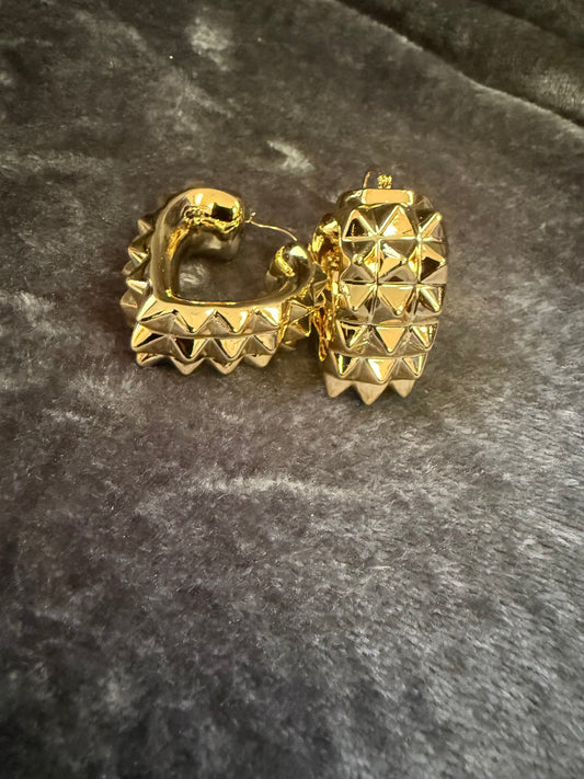 Gold heart shaped spike earring